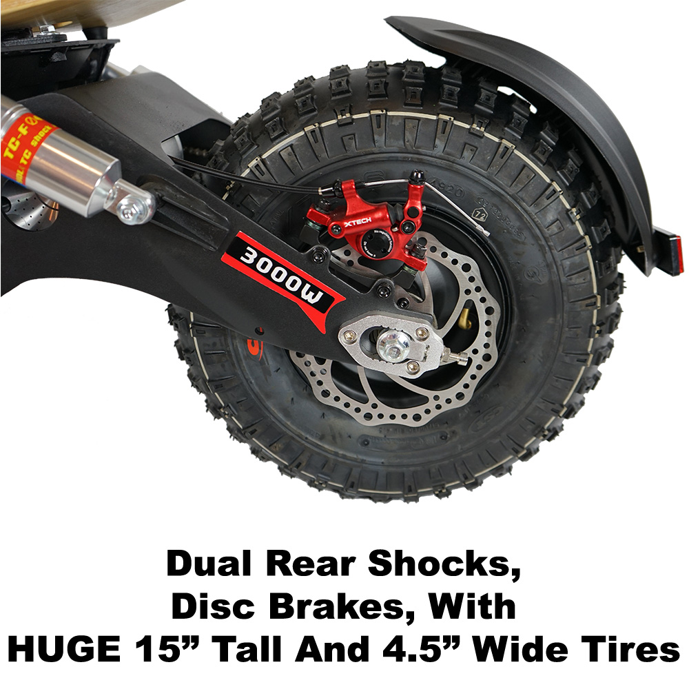 Dual rear shocks, disk brakes with huge 15 inch tall and 4.5 inch wide tires